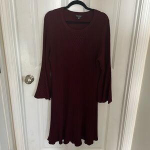 Wine colored sweater dress
V design with holes on front and bell sleeves
